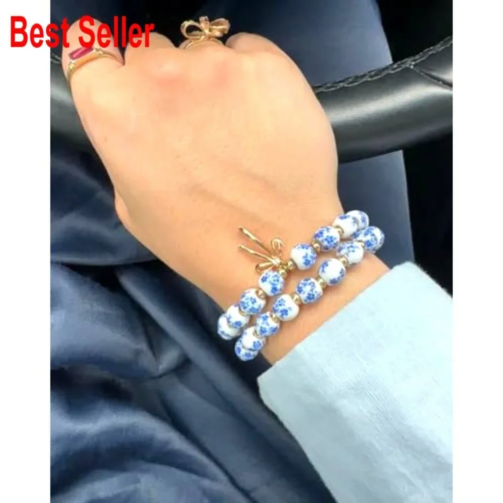 Handmade Stretch Beaded Bracelet with Gold Plated Bow Charm